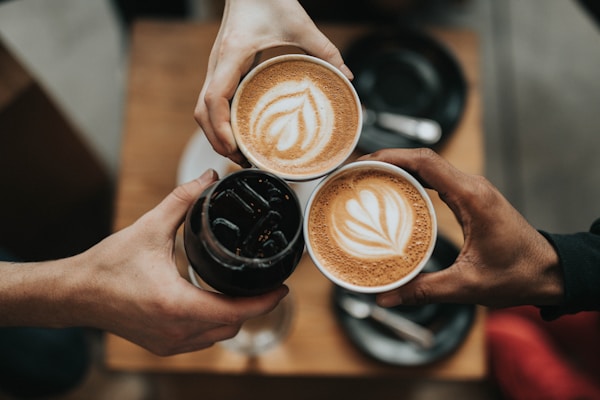 Barista pouring a fresh latte